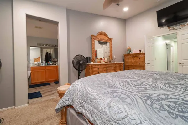 a bathroom with a double vanity sink a mirror and a shower