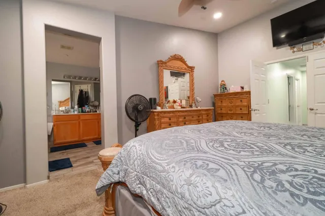 a bathroom with a double vanity sink a mirror and a shower