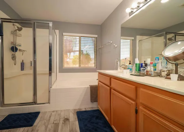 a bathroom with a bathtub and a shower