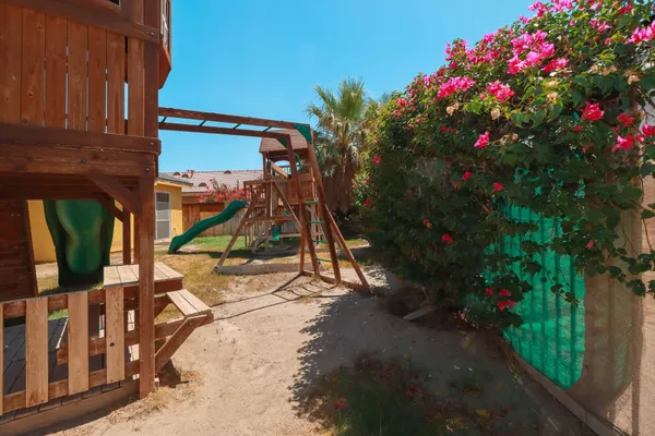a view of a house with a tree