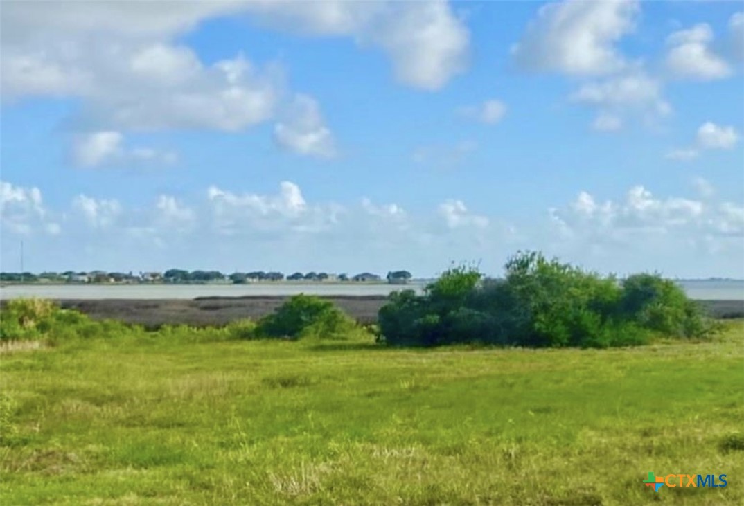 61 Falcon Way Palacios, TX 77465 - Photo 22 of 22 a view of a swimming pool with a yard
