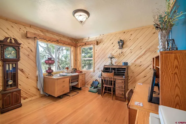 a bathroom with a sink a vanity and a large mirror