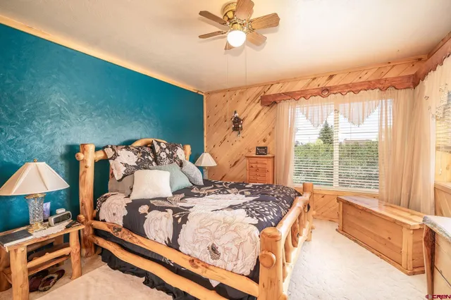 a bathroom with a granite countertop tub sink toilet and shower
