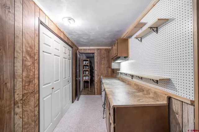 an aerial view of a house with a yard and sitting space