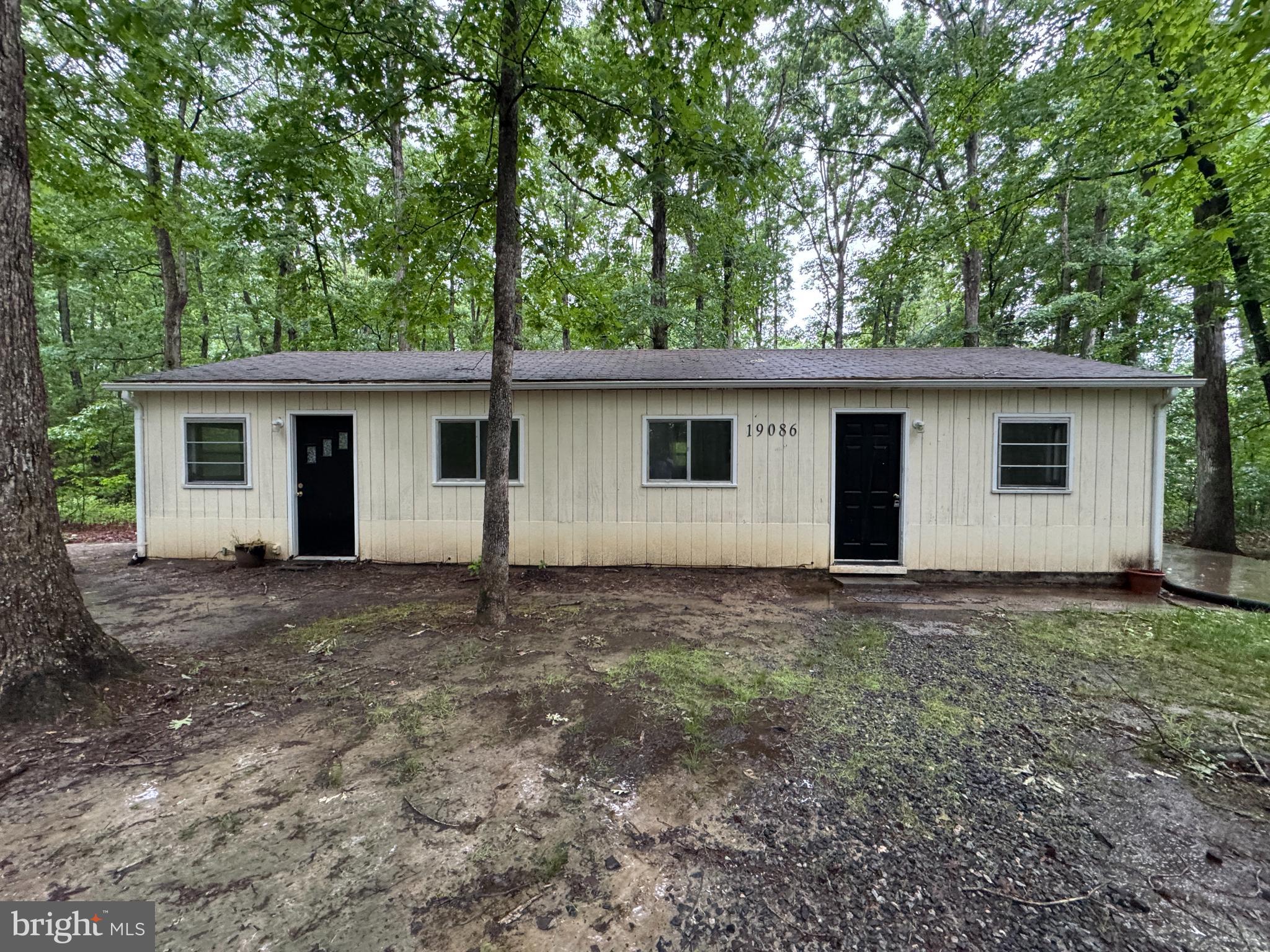 19086 Carlyle Street Ruther Glen, VA 22546 - Photo 1 of 19 a view of a house with a yard and large tree