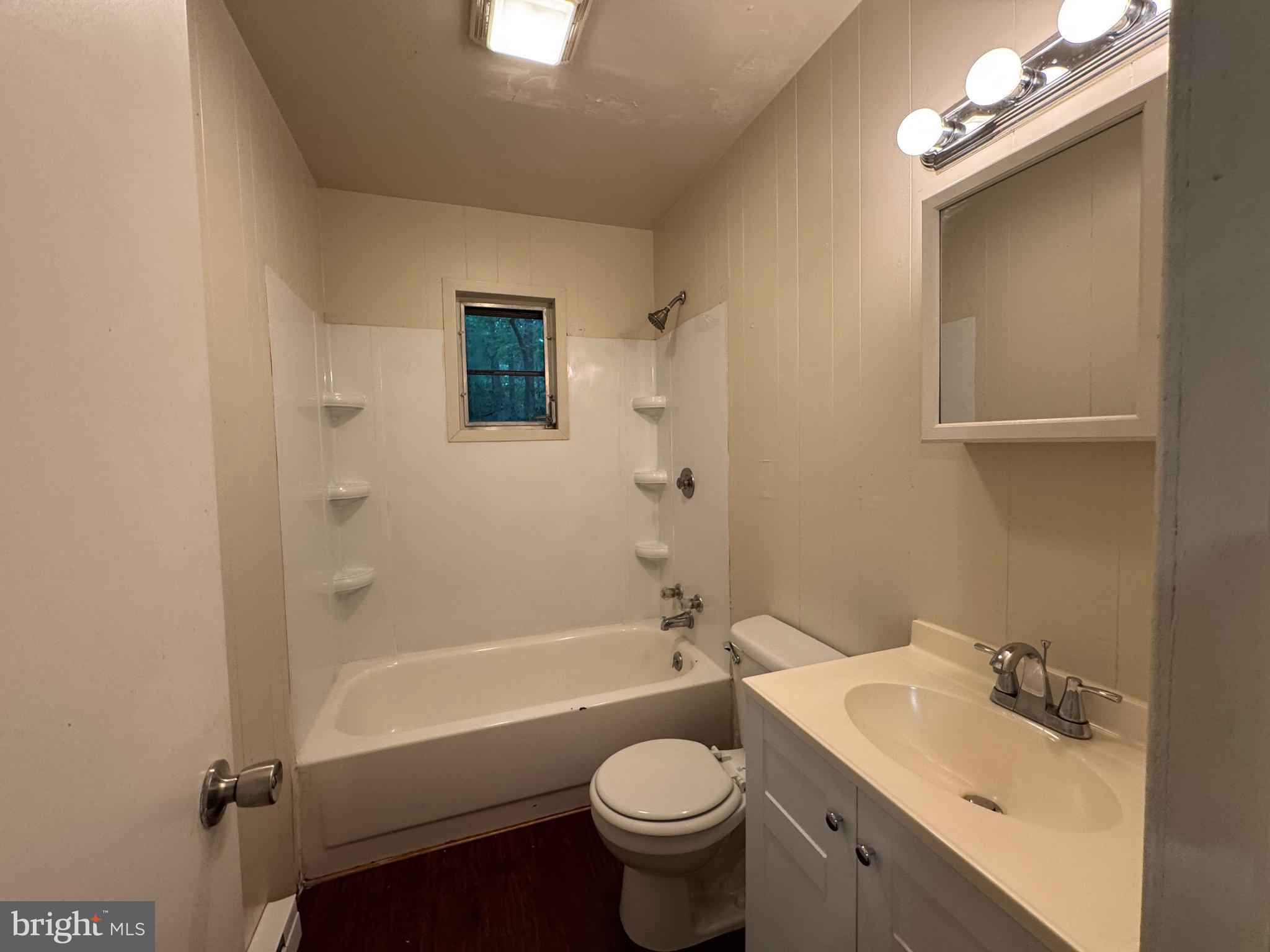 19086 Carlyle Street Ruther Glen, VA 22546 - Photo 11 of 19 a bathroom with a sink a toilet and shower