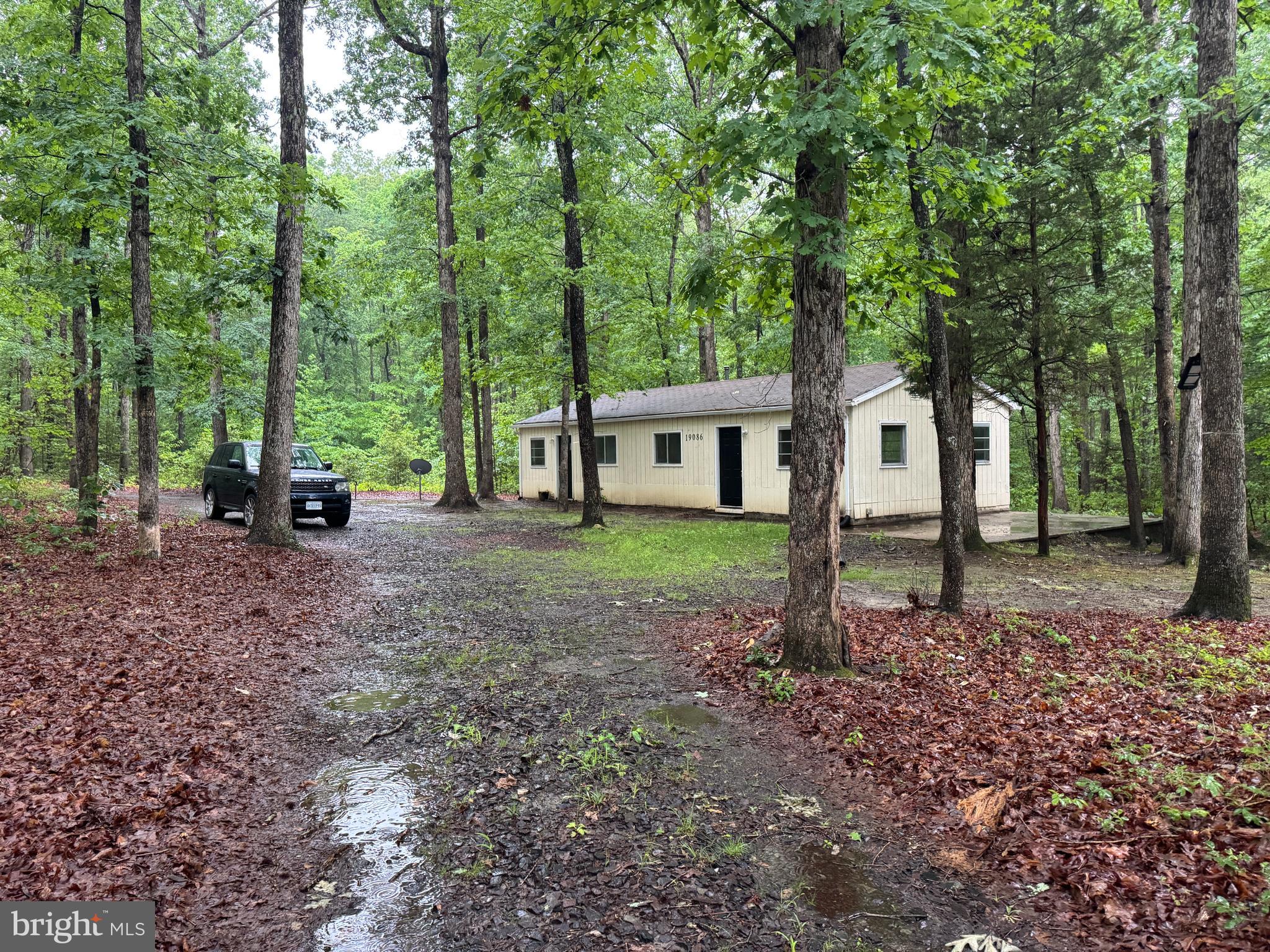 19086 Carlyle Street Ruther Glen, VA 22546 - Photo 15 of 19 a view of a house with a backyard