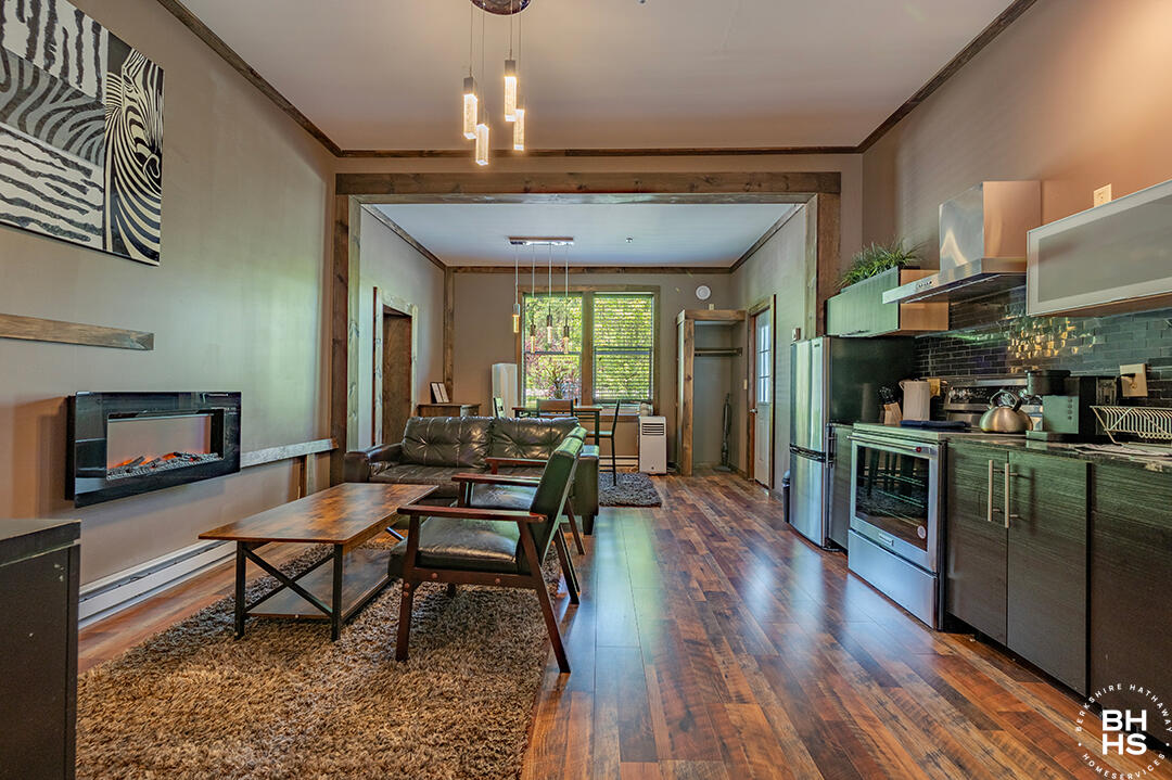 6143 Sentinel Road, Unit # 1 Lake Placid, NY 12946 - Photo 1 of 19 Downhill1Condo_Summer_LR_Kitchen