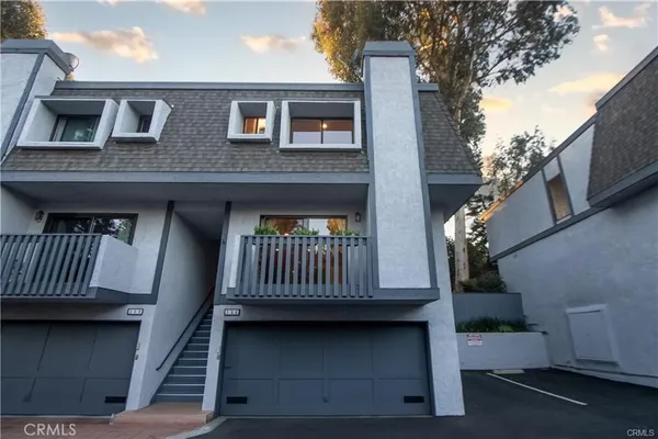a view of balcony with furniture and a window