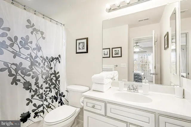 a living room with furniture a projector and a flat screen tv