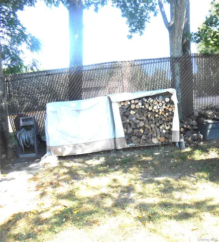 a view of a house with backyard porch and sitting area