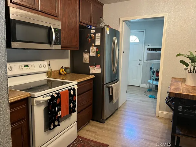 a kitchen with a stove microwave and refrigerator