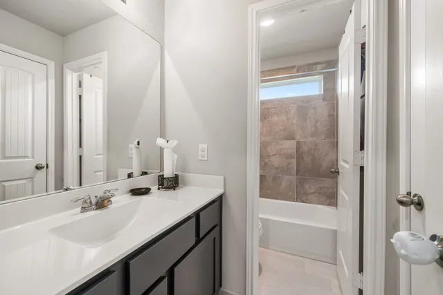 a bathroom with a double vanity sink mirror and double