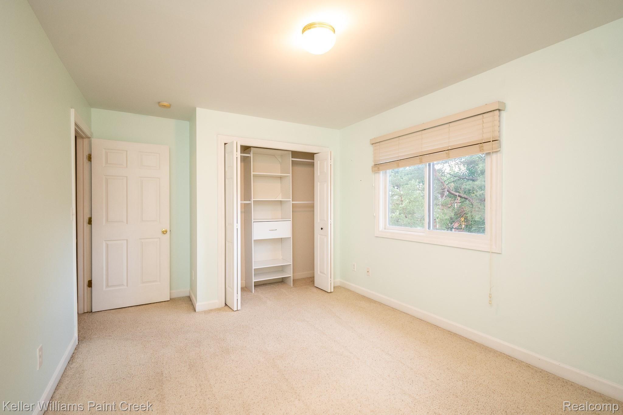 3307 Hazelton Avenue Rochester, MI 48307 - Photo 31 of 41 Upper level bedroom with closet featuring built in shelving