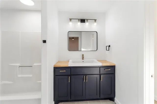 a bathroom with a sink and a mirror