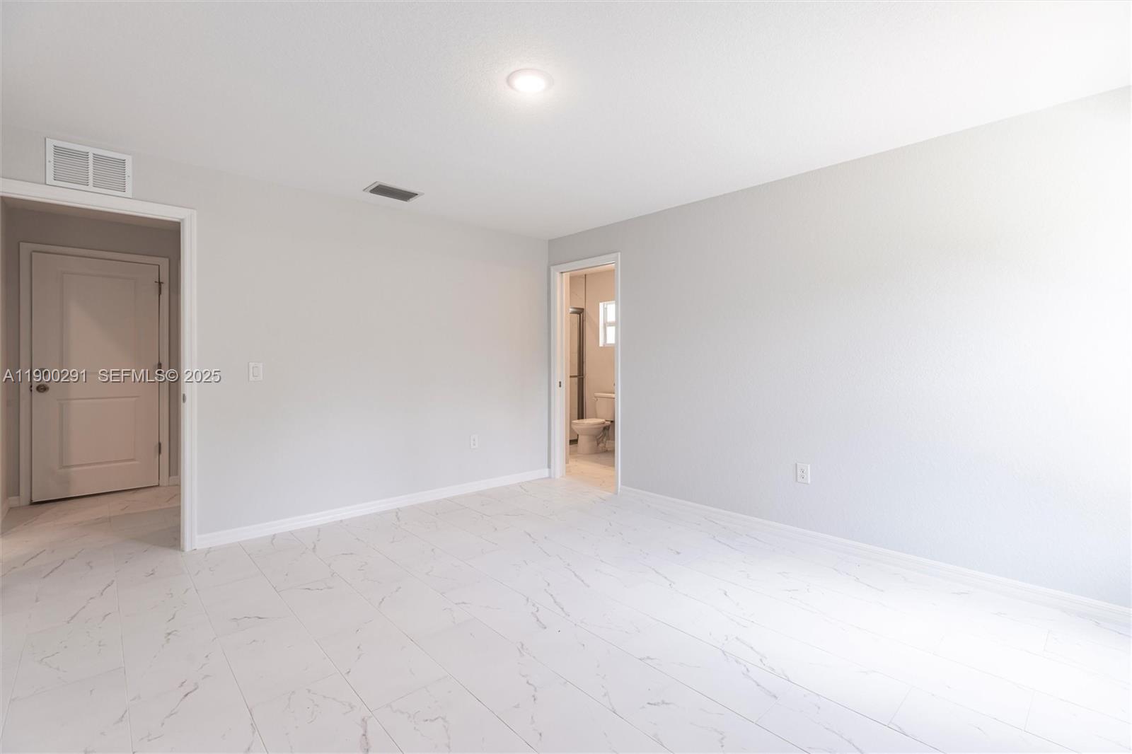 2004 Rosa Court, Unit 2004 Lehigh Acres, FL 33972 - Photo 9 of 23 an empty room with an entryway