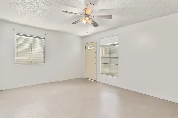 a view of an empty room with a window