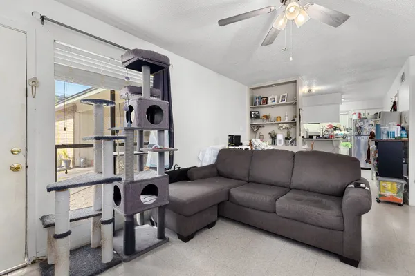 a living room with furniture and a window