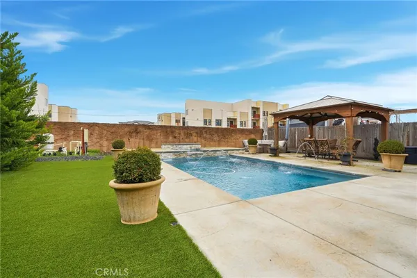 a view of a swimming pool with a chairs