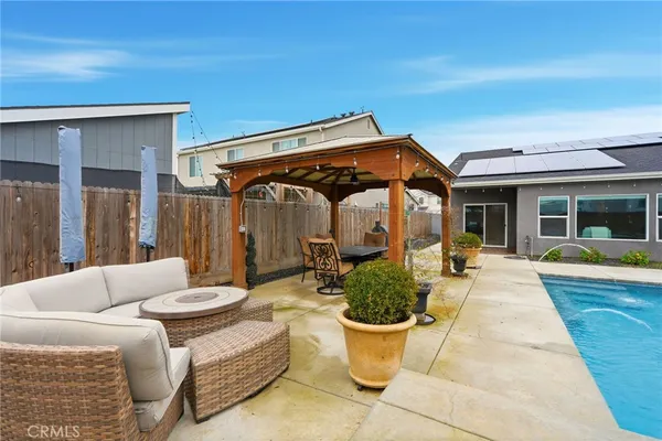 a view of a patio with couches table and chairs