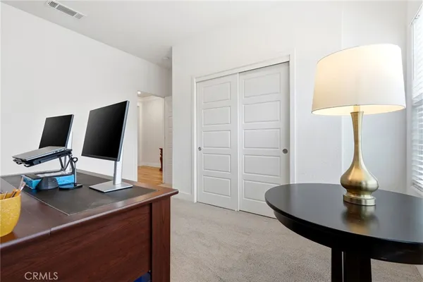 a view of a workspace with furniture