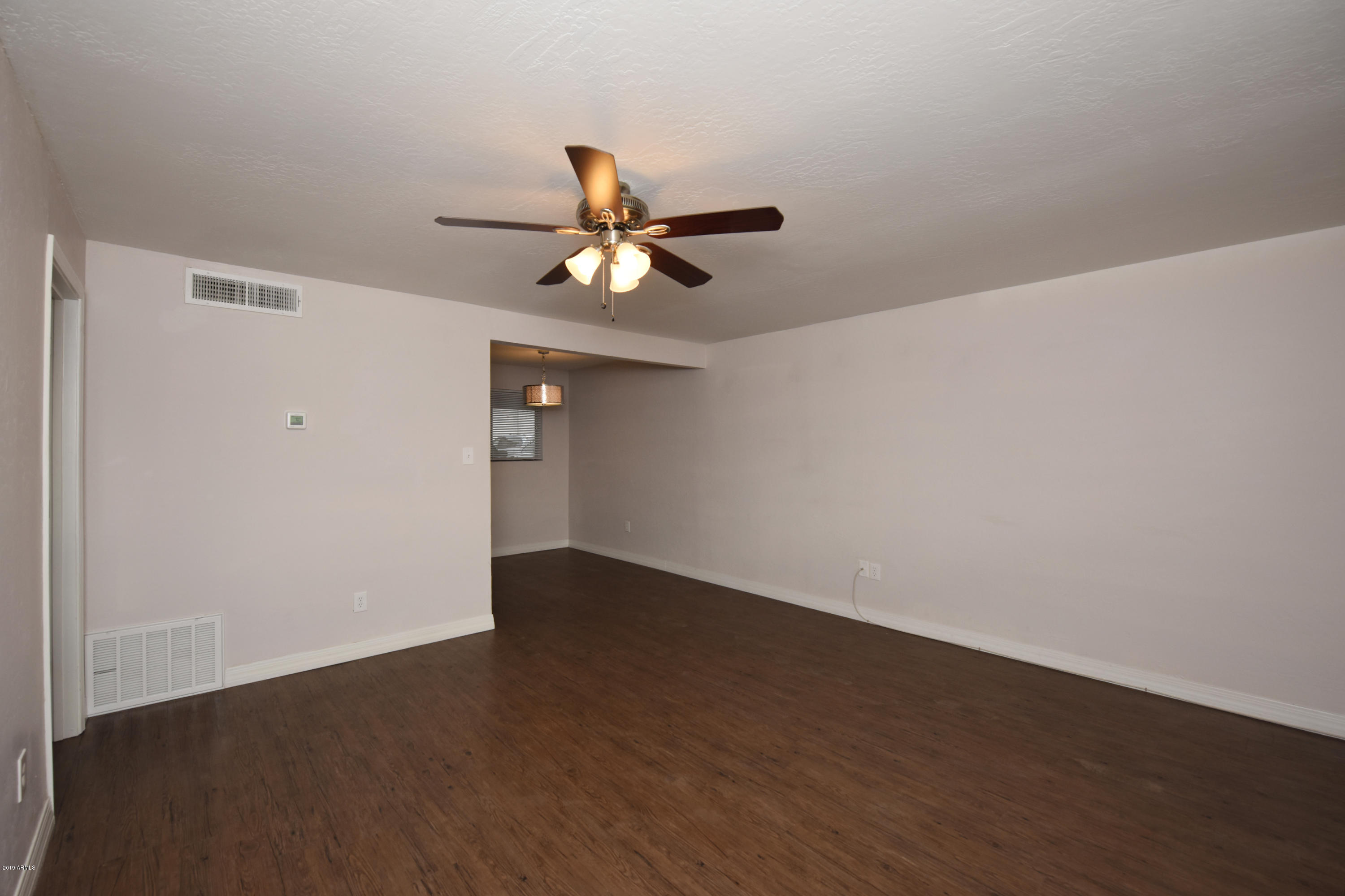 502 East Mariposa Street, Unit 101 Phoenix, AZ 85012 - Photo 13 of 24 wooden floor in an empty room