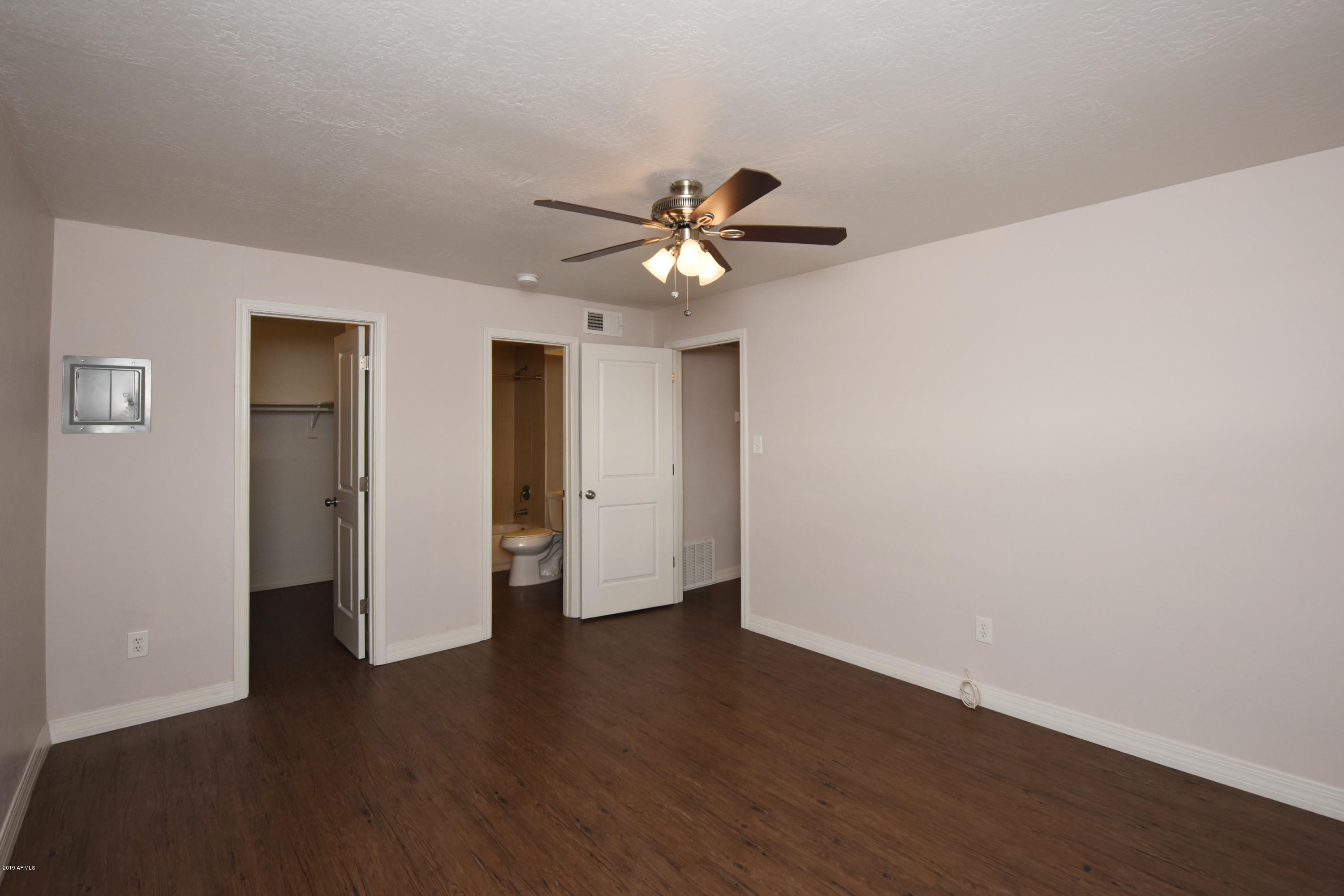 502 East Mariposa Street, Unit 101 Phoenix, AZ 85012 - Photo 15 of 24 a view of an empty room with wooden floor