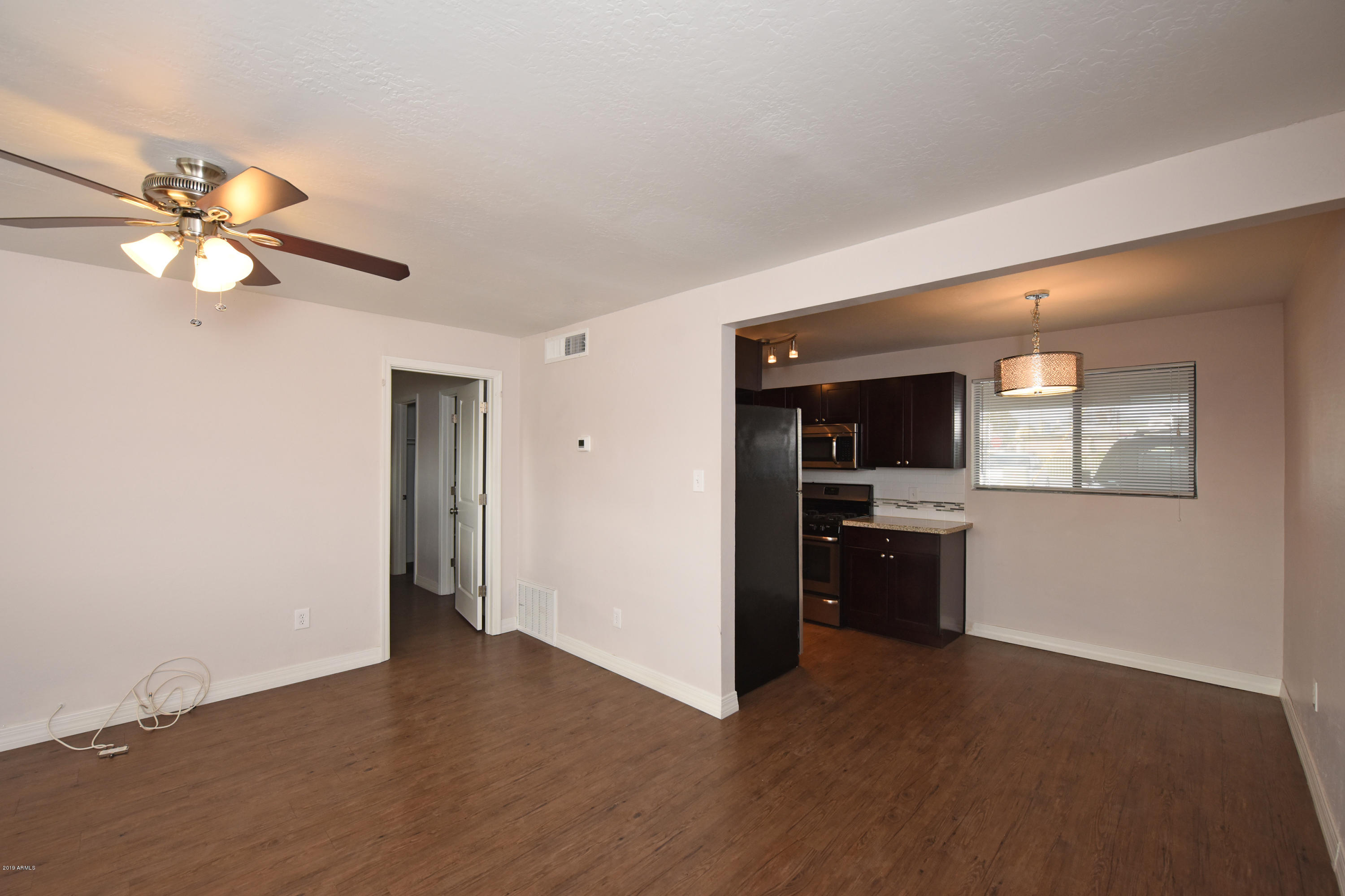 502 East Mariposa Street, Unit 101 Phoenix, AZ 85012 - Photo 8 of 24 a view of a kitchen with a sink a kitchen and a refrigerator