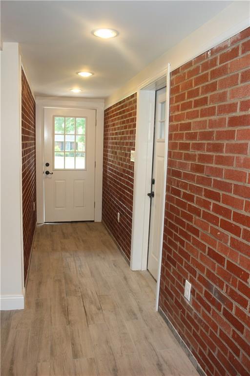 236 McCoy Place Road Sewickley, PA 15143 - Photo 13 of 19 extra long entry way with exposed brick