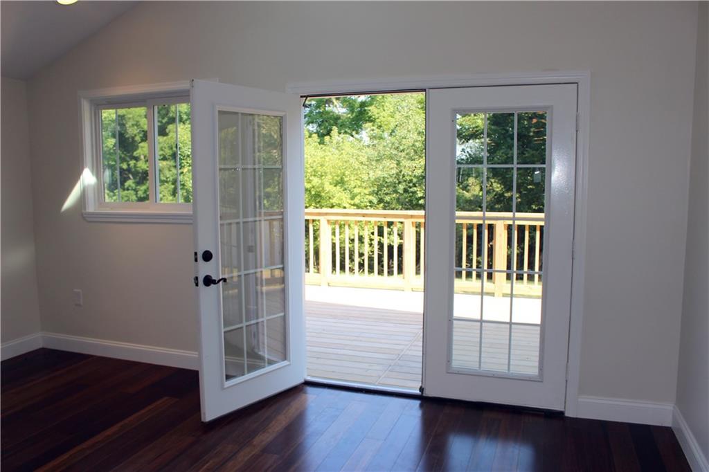 236 McCoy Place Road Sewickley, PA 15143 - Photo 6 of 19 French doors in the dining area lead to the new, roomy deck that overlooks the vast backyard and private wooded area.