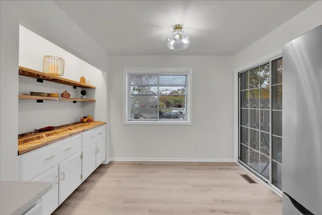 a view of a kitchen with furniture and a window