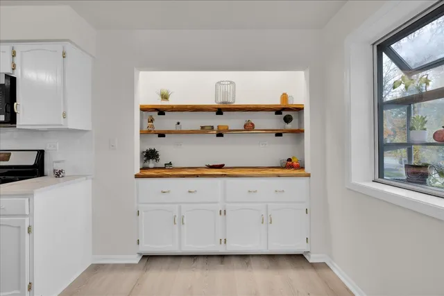 a view of cabinets and wooden floor