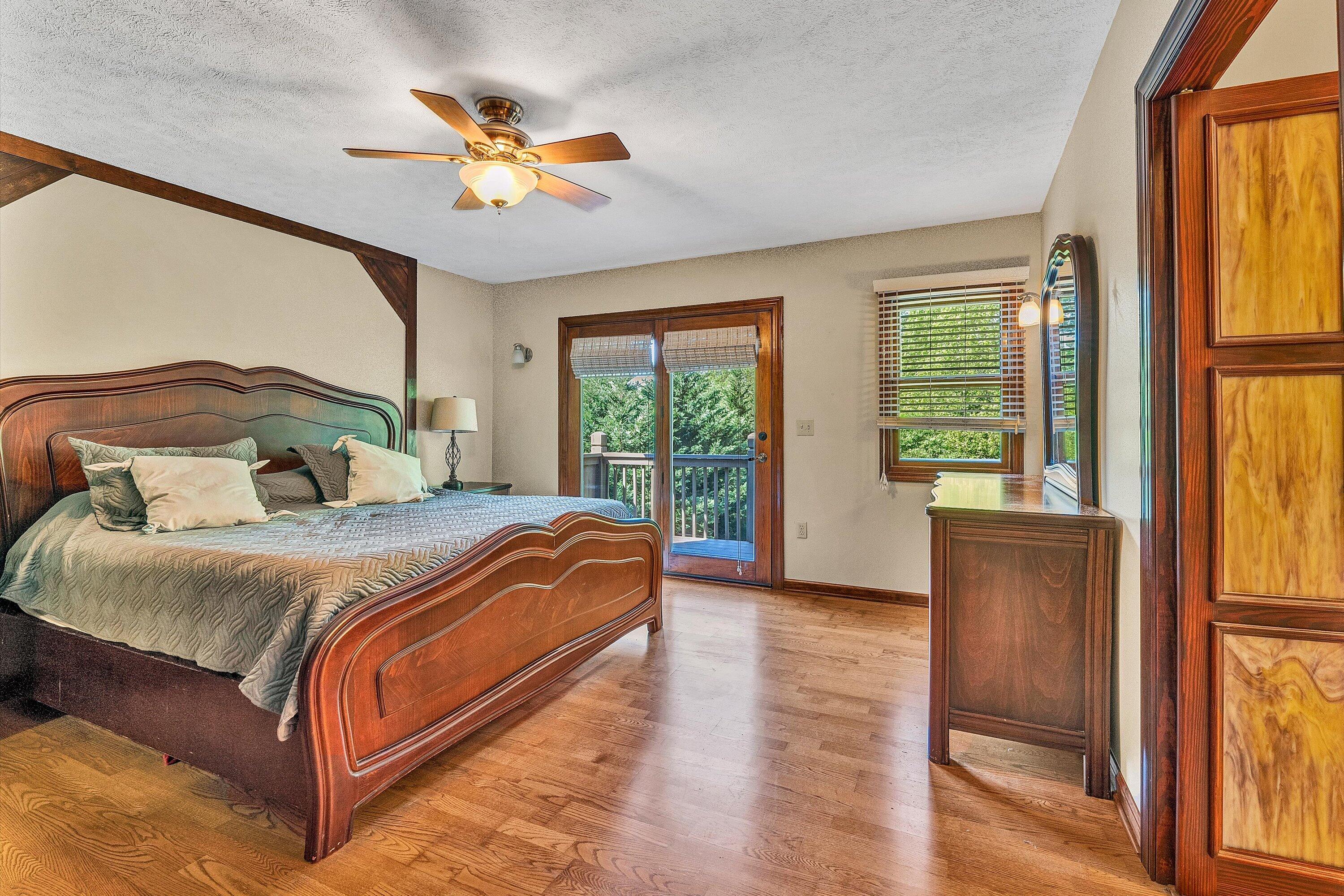 400 Harbor Moneta, VA 24121 - Photo 19 of 51 a bedroom with a large bed and a large window