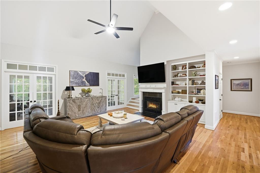 320 Allendale Drive Canton, GA 30115 - Photo 18 of 70 a living room with furniture a fireplace and a flat screen tv