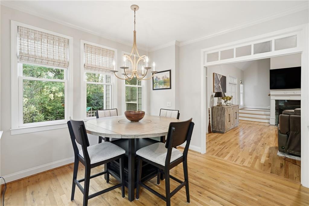 320 Allendale Drive Canton, GA 30115 - Photo 24 of 70 a view of a dining room with furniture a chandelier and wooden floor