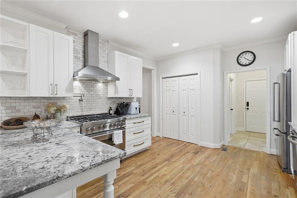 320 Allendale Drive Canton, GA 30115 - Photo 28 of 70 a kitchen with stainless steel appliances granite countertop a sink stove and refrigerator
