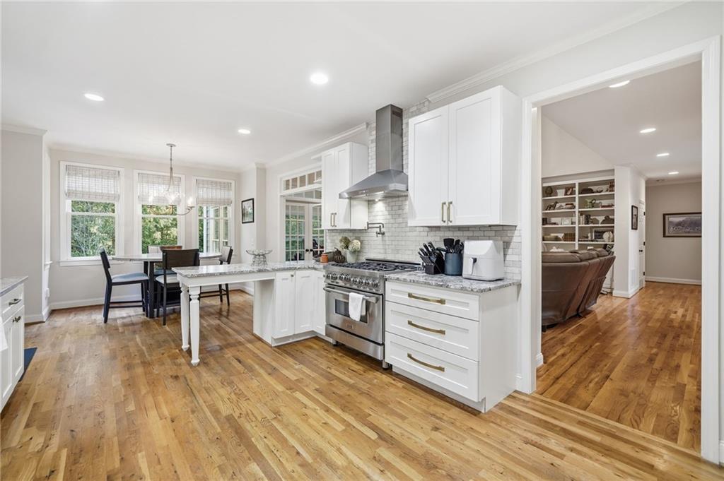 320 Allendale Drive Canton, GA 30115 - Photo 33 of 70 a kitchen with white cabinets and wooden floor