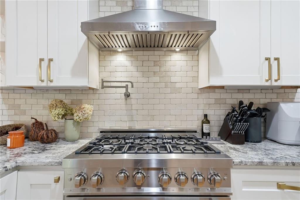 320 Allendale Drive Canton, GA 30115 - Photo 35 of 70 a kitchen with a stove and cabinets