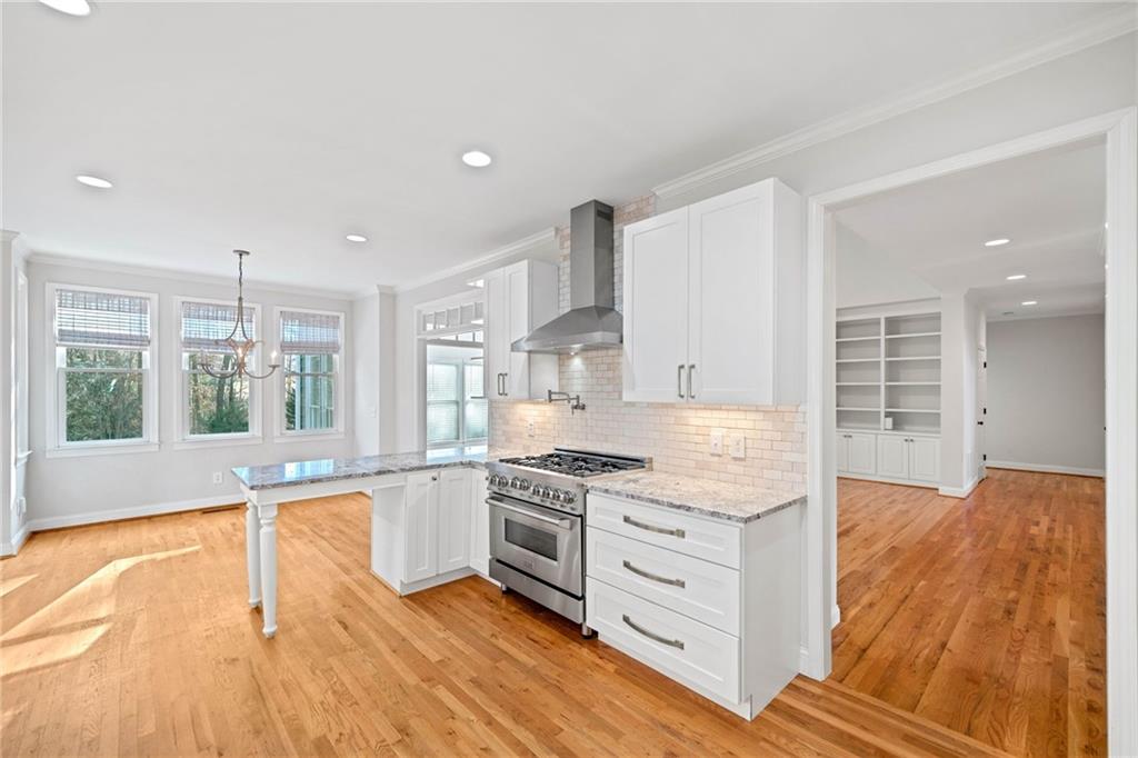 320 Allendale Drive Canton, GA 30115 - Photo 36 of 70 a kitchen with stainless steel appliances granite countertop a stove and a wooden floors