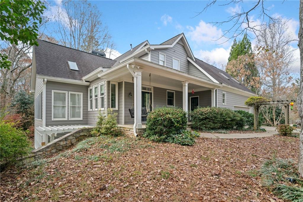 320 Allendale Drive Canton, GA 30115 - Photo 4 of 70 a front view of a house with a garden