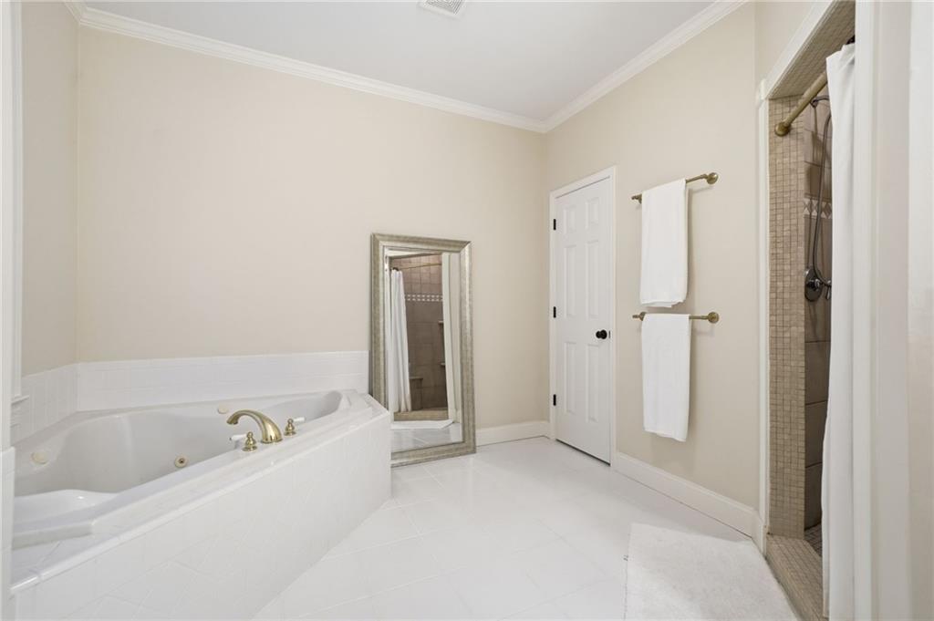 320 Allendale Drive Canton, GA 30115 - Photo 44 of 70 a bathroom with a bathtub and a shower