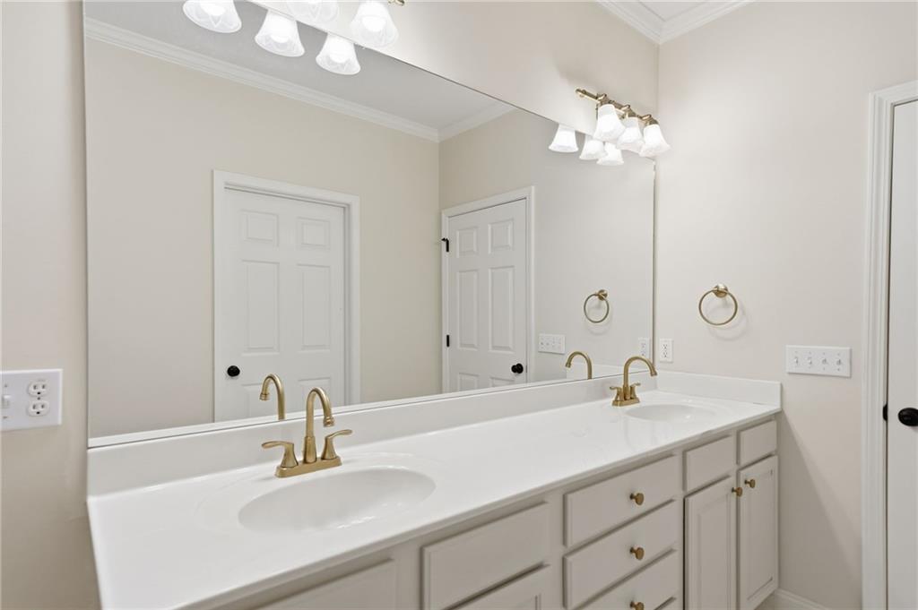 320 Allendale Drive Canton, GA 30115 - Photo 46 of 70 a bathroom with a sink and a mirror