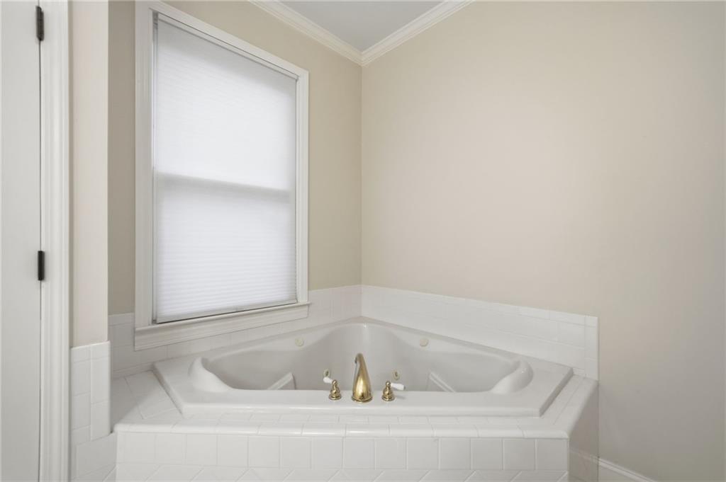 320 Allendale Drive Canton, GA 30115 - Photo 47 of 70 a white bath tub sitting in a bathroom
