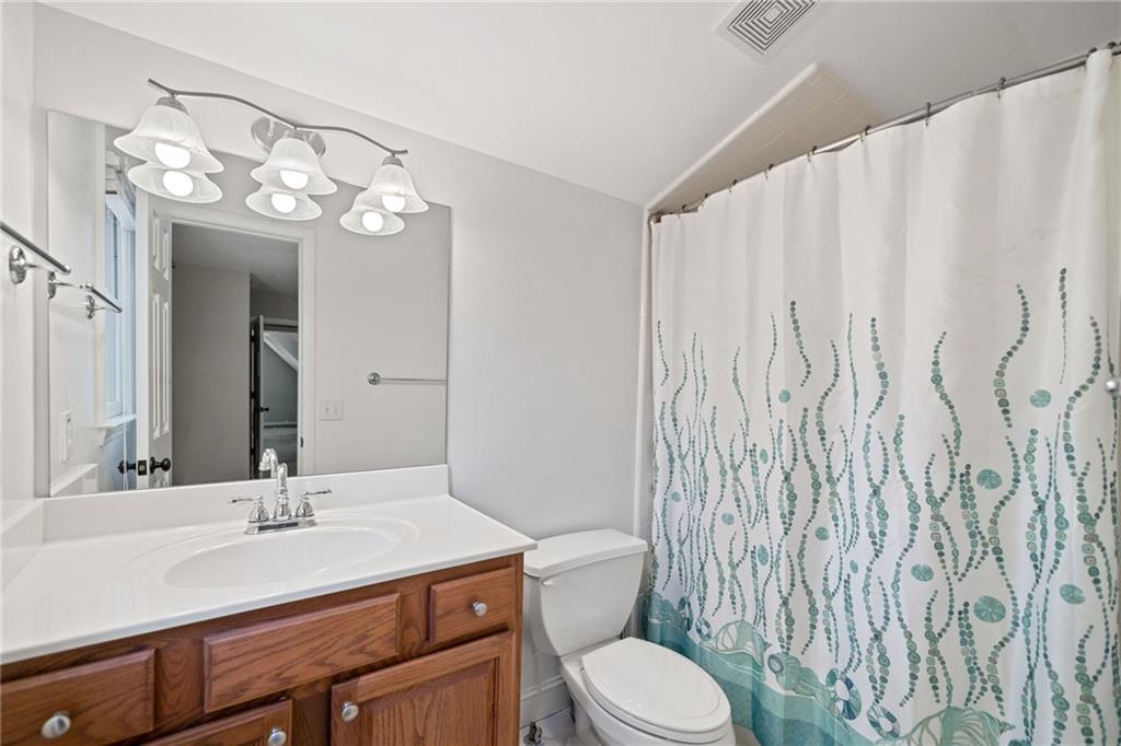 320 Allendale Drive Canton, GA 30115 - Photo 56 of 70 a bathroom with a granite countertop sink a toilet and a mirror
