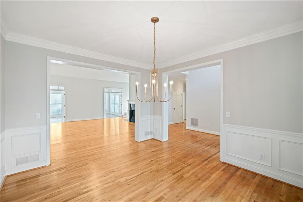 320 Allendale Drive Canton, GA 30115 - Photo 9 of 70 a view of a kitchen with wooden floor and chandelier