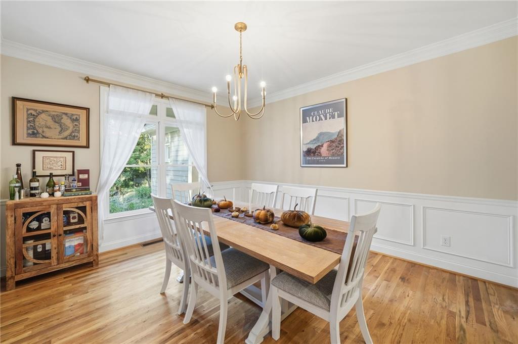 320 Allendale Drive Canton, GA 30115 - Photo 10 of 70 a dining room with furniture a chandelier and wooden floor