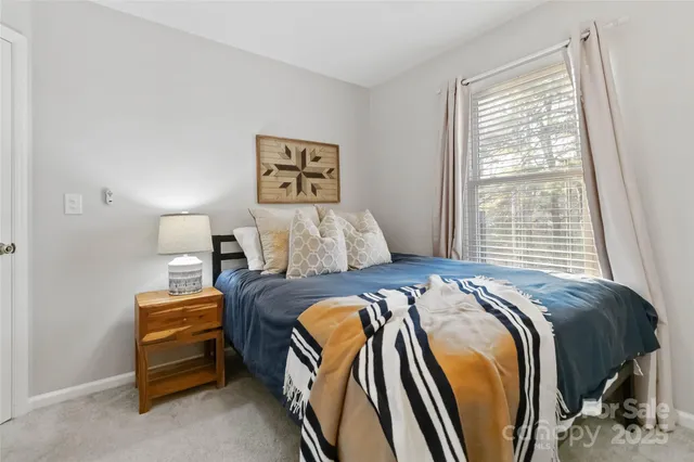 a bedroom with bed and window