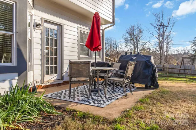 a view of a backyard with sitting area