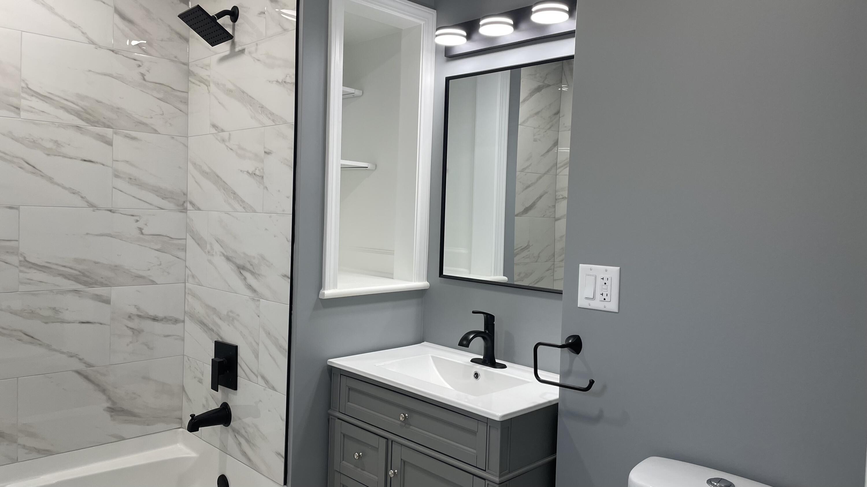 3362 Virginia Street Gary, IN 46409 - Photo 11 of 29 a bathroom with a sink vanity toilet and tub