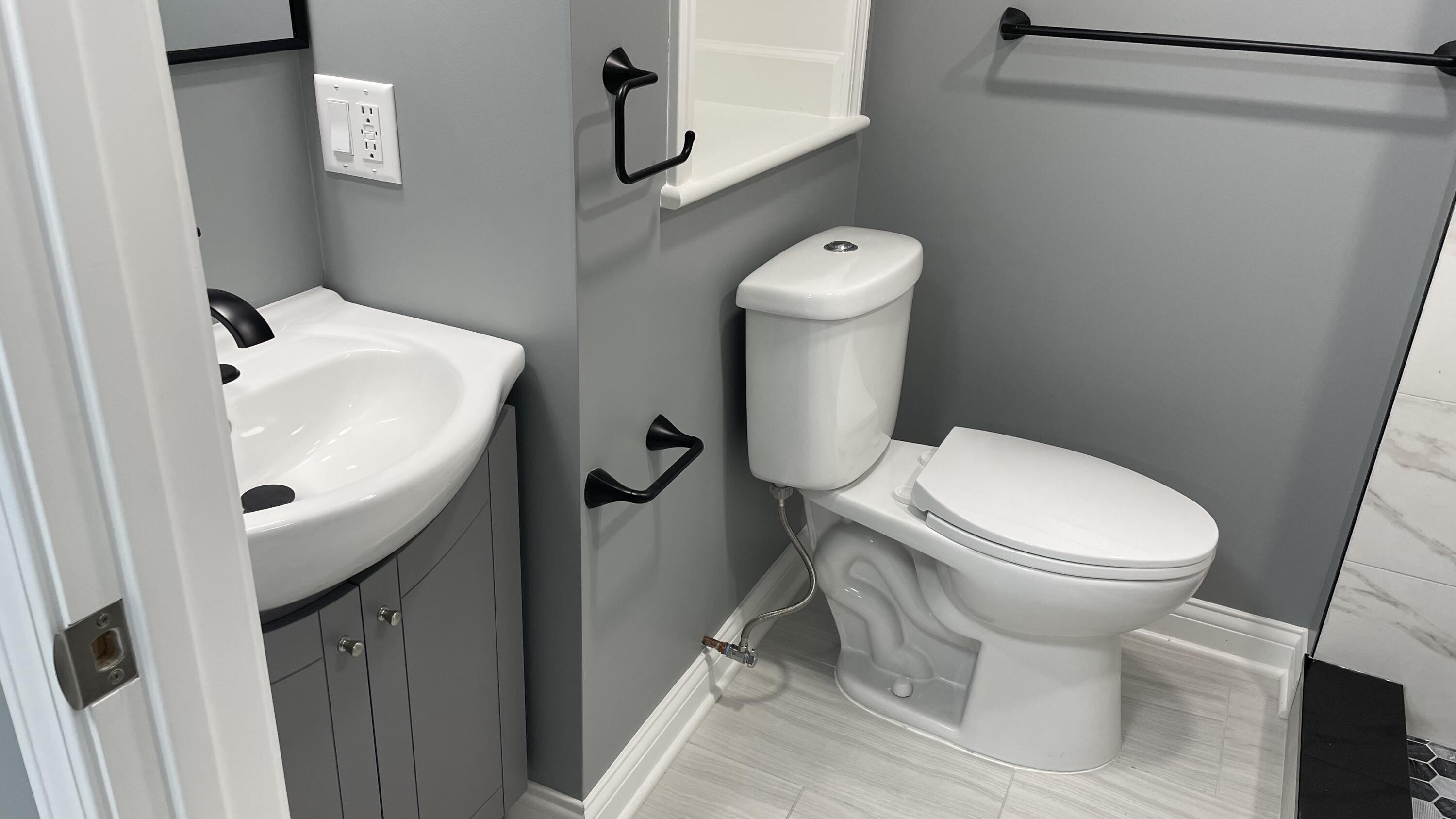 3362 Virginia Street Gary, IN 46409 - Photo 14 of 29 a white toilet sitting next to a white sink